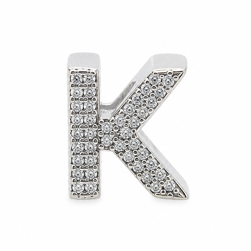 A sterling silver letter 'K' charm embellished with clear pavé stones, shown on a plain white background.