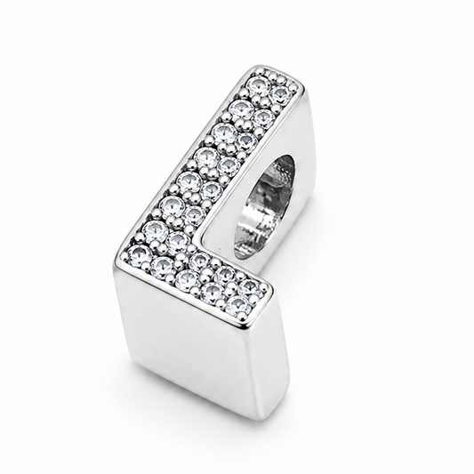 A sterling silver letter 'L' charm bead embellished with pavé-set clear crystals on a plain white background.