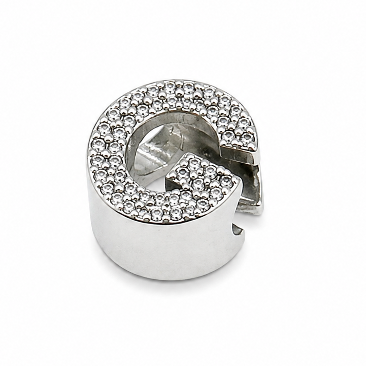 Sterling silver letter 'G' initial charm shown from the back which is polished silver. On a white background.