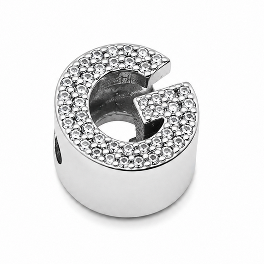 Sterling silver letter 'G' initial charm with cubic zirconia stones covering the front of the letter. On a white background.