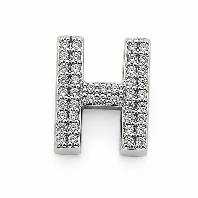 A sterling silver letter H charm photographed from the back with a polished finish and a '925' silver purity stamp on one end, shown on a clean white background.