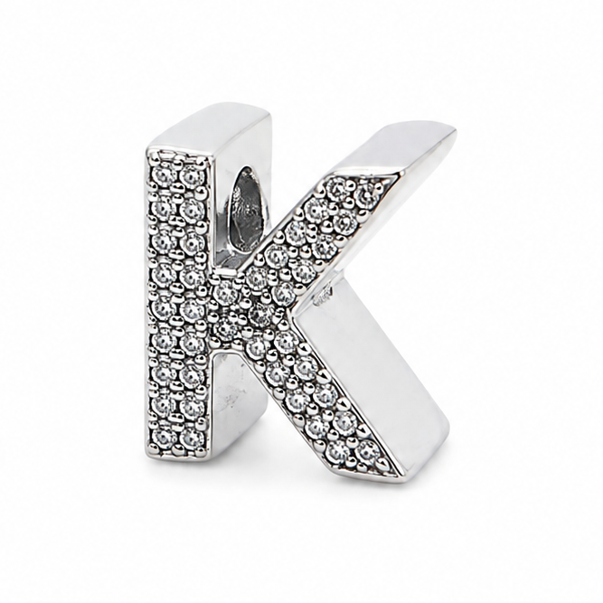 A sterling silver letter 'K' initial charm embellished with small clear pavé stones, shown on a plain white background.