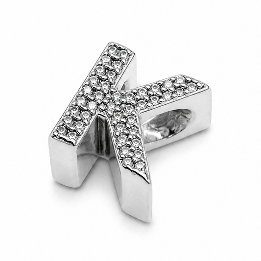 A sterling silver letter 'K' initial charm embellished with small clear pavé stones, shown on a clean white background.