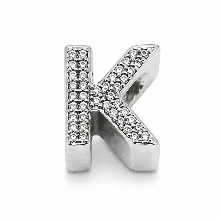 A sterling silver letter 'K' initial charm embellished with small clear pavé stones, shown on a clean white background.