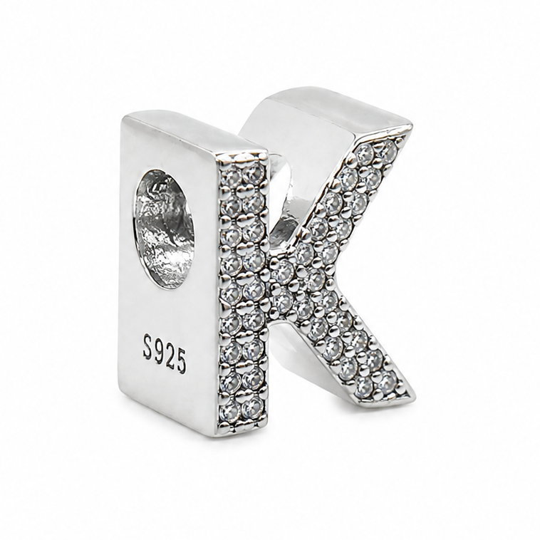 A sterling silver letter 'K' initial charm embellished with clear pavé rhinestones, featuring a threaded hole on the side with 'S925' sterling silver stamp, on a white background.