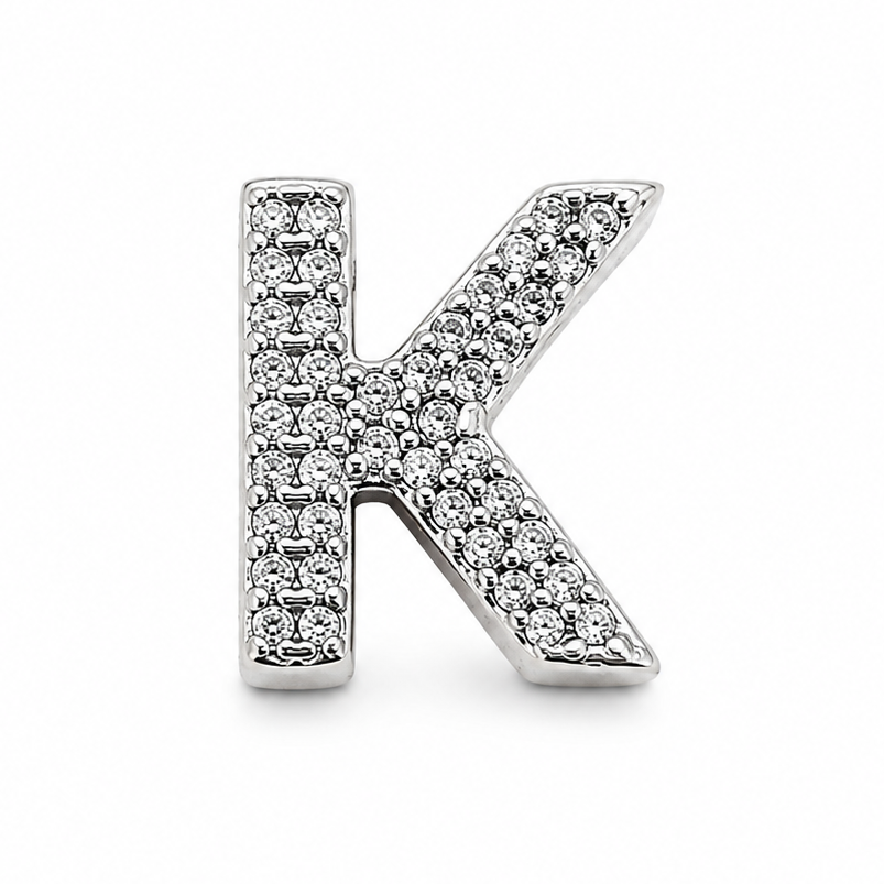 A sterling silver letter 'K' initial charm embellished with small clear pavé stones, shown on a plain white background.