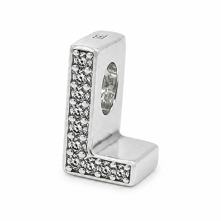 A sterling silver letter 'L' charm bead embellished with pavé-set clear crystals on a plain white background.