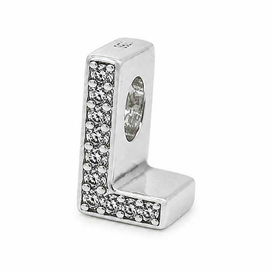 A sterling silver letter 'L' charm bead embellished with pavé-set clear crystals on a plain white background.