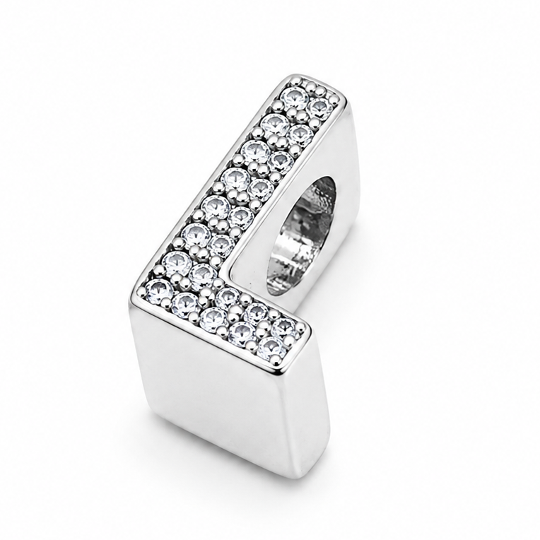 A sterling silver letter 'L' charm bead embellished with pavé-set clear crystals on a plain white background.
