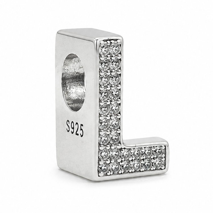 A sterling silver letter 'L' initial charm bead decorated with pavé clear crystals on the top, featuring a .925 sterling silver hallmark on the side, set against a plain white background.