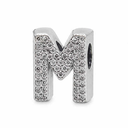A sterling silver letter 'M' initial charm embellished with pavé-set clear stones, shown on a clean white background.