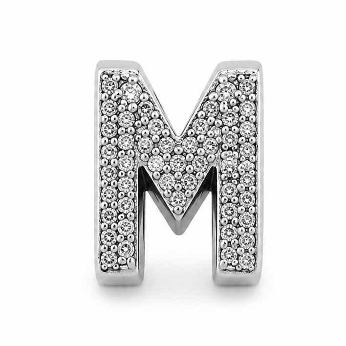 A silver letter 'M' charm embellished with pave-set clear crystals, shown on a clean white background.