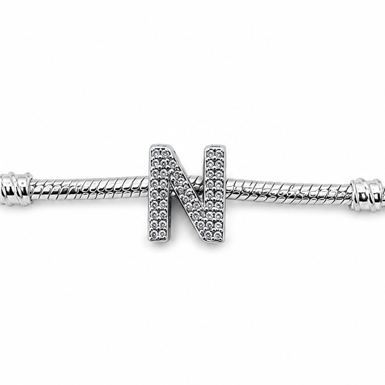 A sterling silver letter 'N' charm bead embellished with clear rhinestones, shown on a plain white background.
