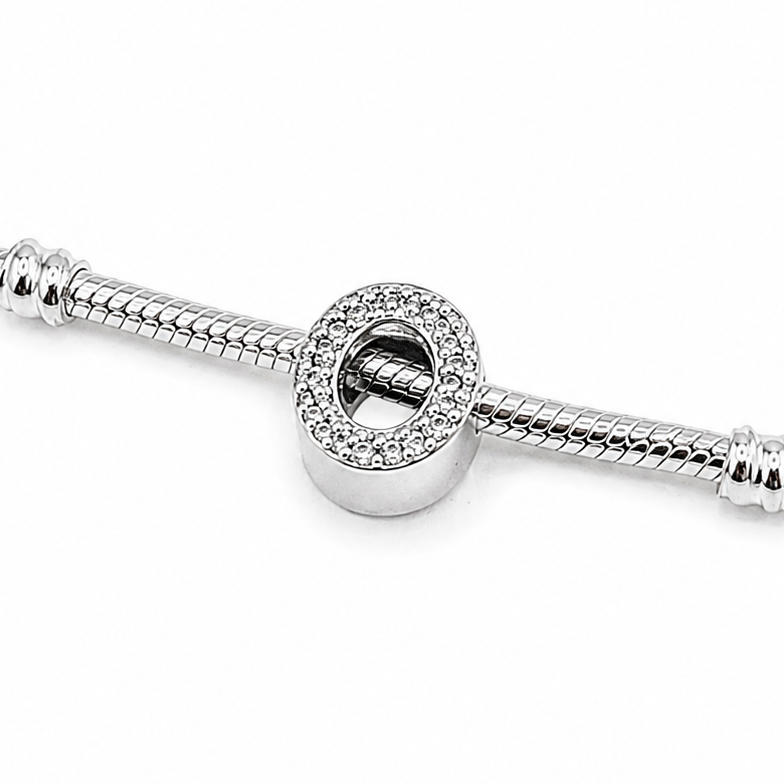 A sterling silver letter 'O' charm bead embellished with clear rhinestones 