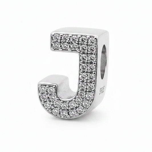 A sterling silver letter 'J' charm embellished with small clear rhinestones, shown on a clean white background.
